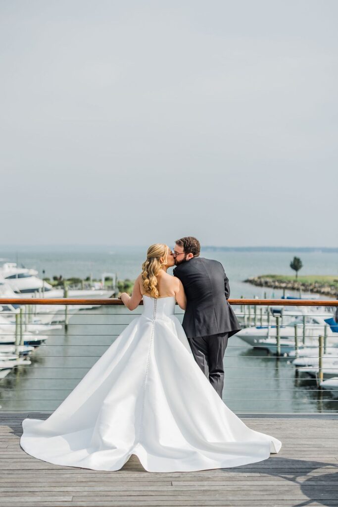 Newlyweds kiss at coastal Long Island wedding venue