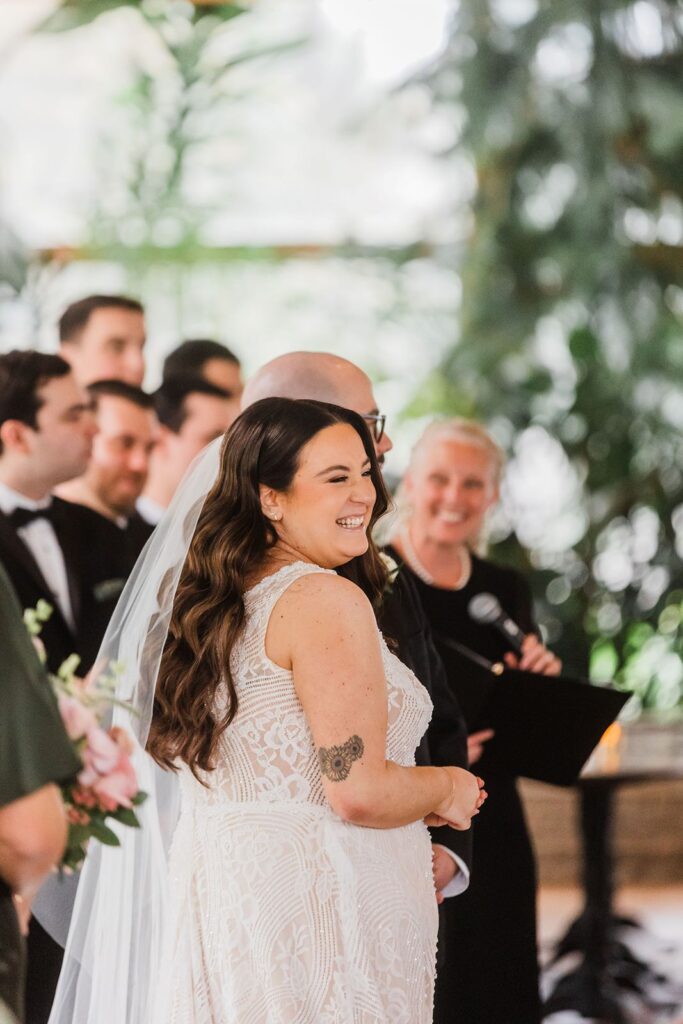 Bride smiles at Flowerfield wedding ceremony.