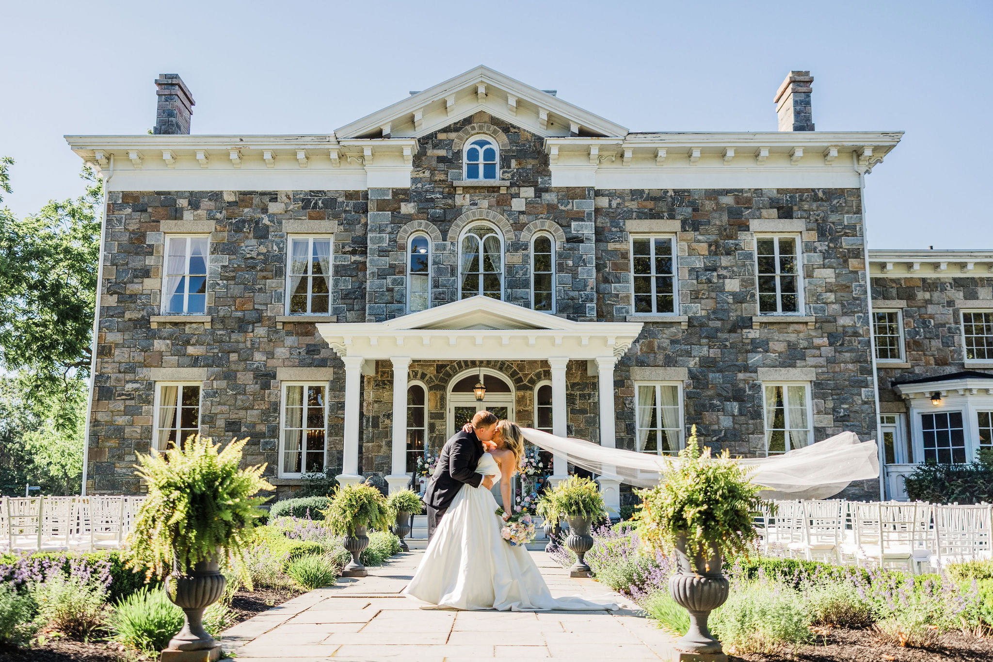 Newlyweds kiss for Brecknock Hall wedding portrait