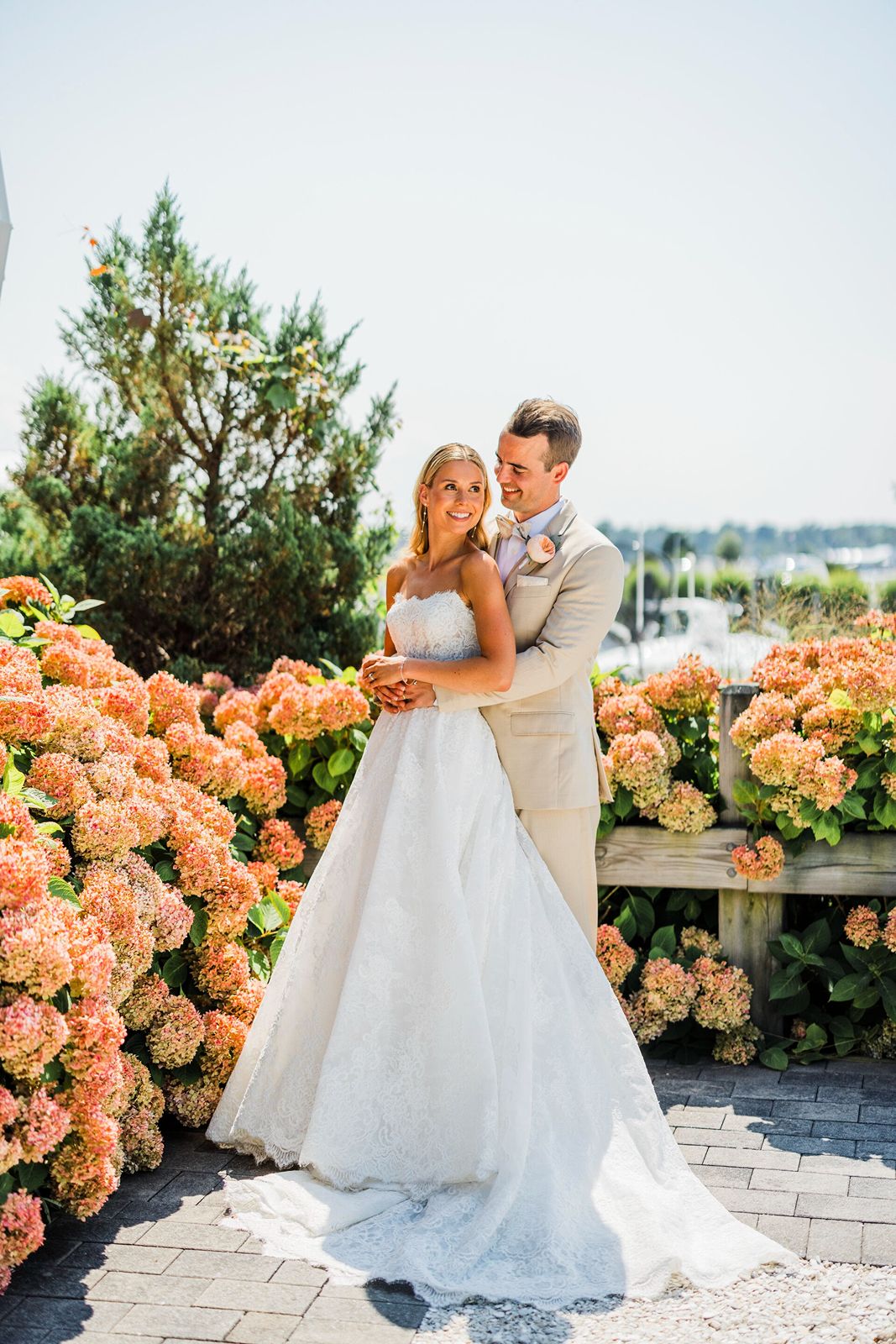 Bride and groom pose for Long Island wedding photographer